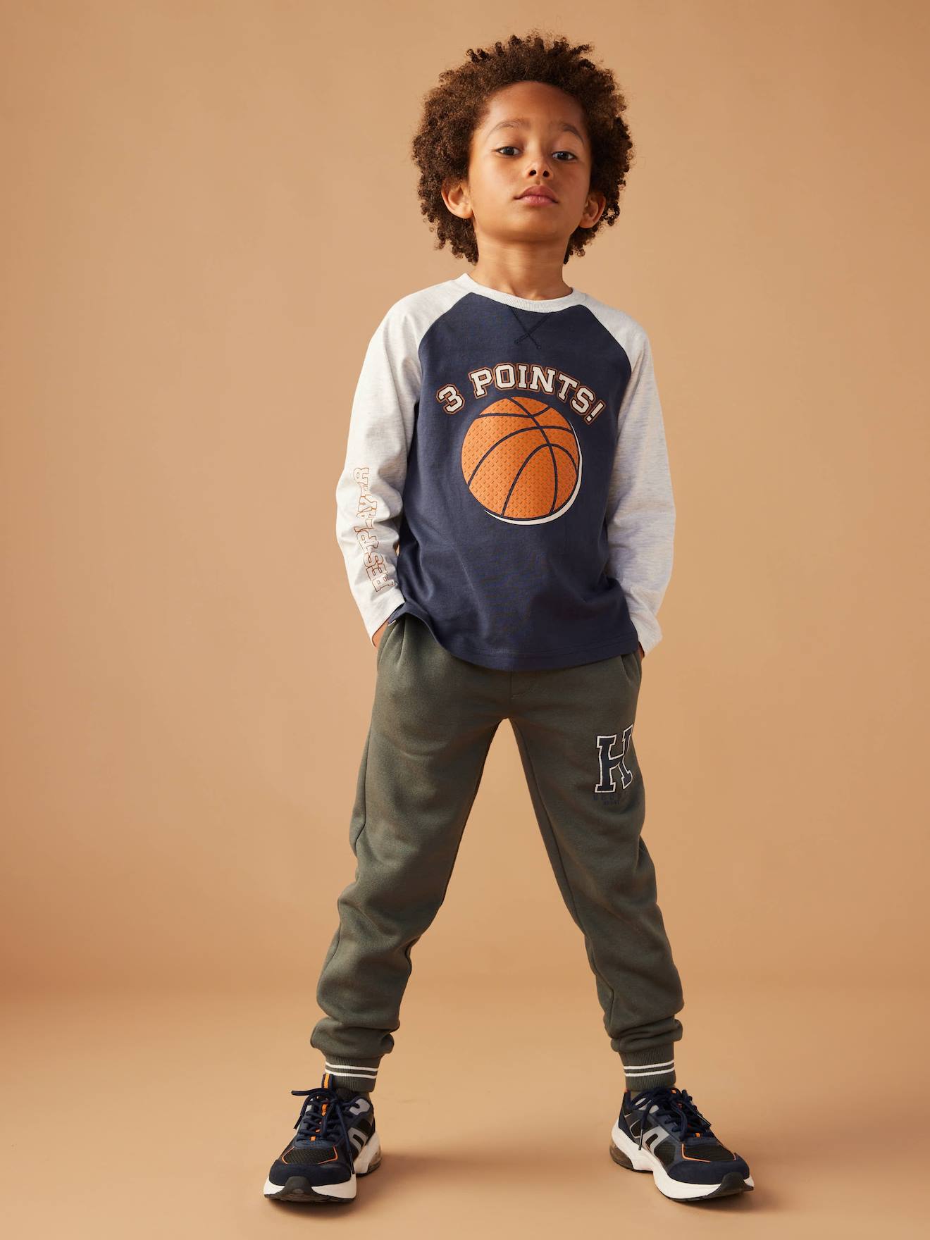 Top with Ball Motif in Relief & Contrasting Raglan Sleeves